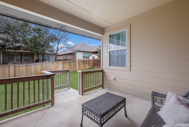 view of patio / terrace featuring fence