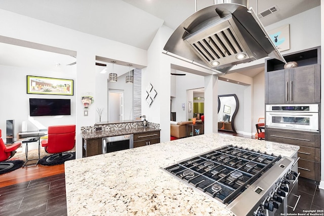 kitchen with wine cooler, gas stovetop, open floor plan, ventilation hood, and oven