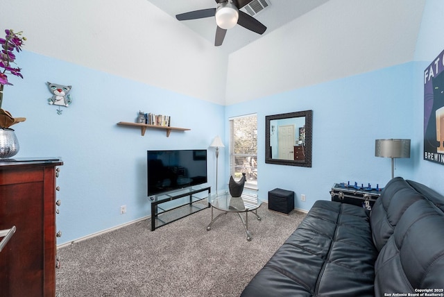 living area featuring ceiling fan, carpet floors, visible vents, and baseboards