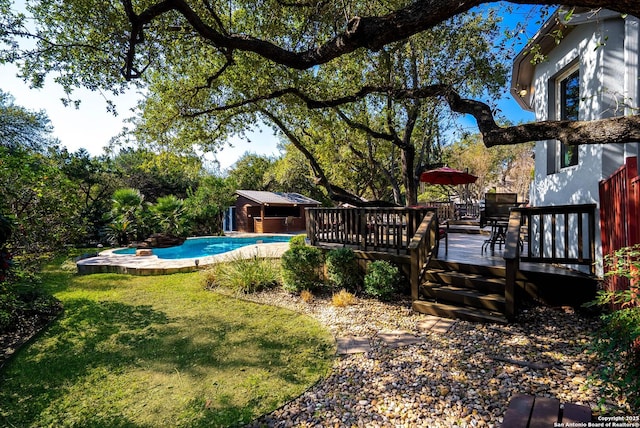 view of yard with an outdoor pool and a deck