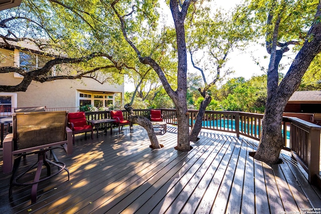 wooden deck with an outdoor pool