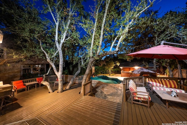 wooden deck with a jacuzzi