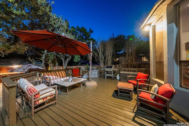 deck at twilight with an outdoor hangout area