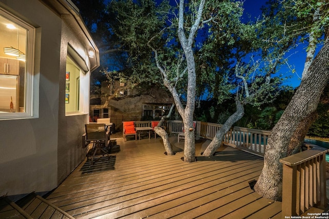 view of deck at twilight