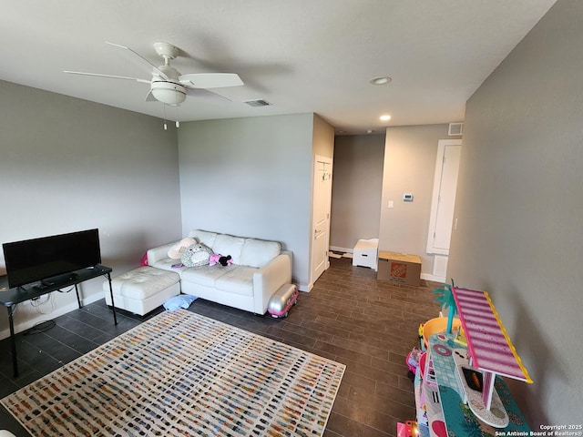 living room featuring visible vents, baseboards, ceiling fan, and recessed lighting