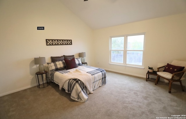 bedroom featuring carpet floors, high vaulted ceiling, and baseboards