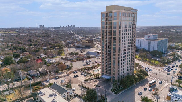 birds eye view of property featuring a city view