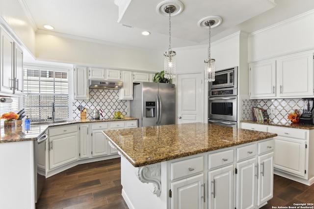 kitchen with dark wood finished floors, a center island, stainless steel appliances, under cabinet range hood, and a sink