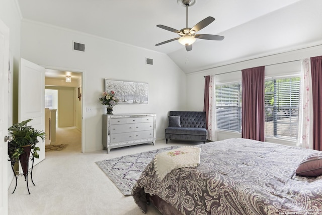 bedroom featuring carpet floors, lofted ceiling, visible vents, and a ceiling fan