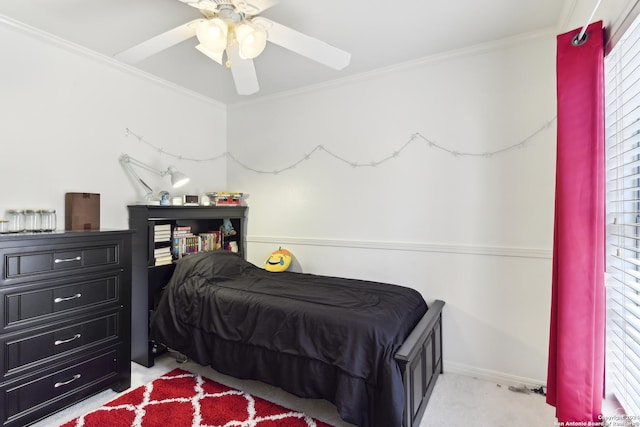 bedroom with a ceiling fan and crown molding