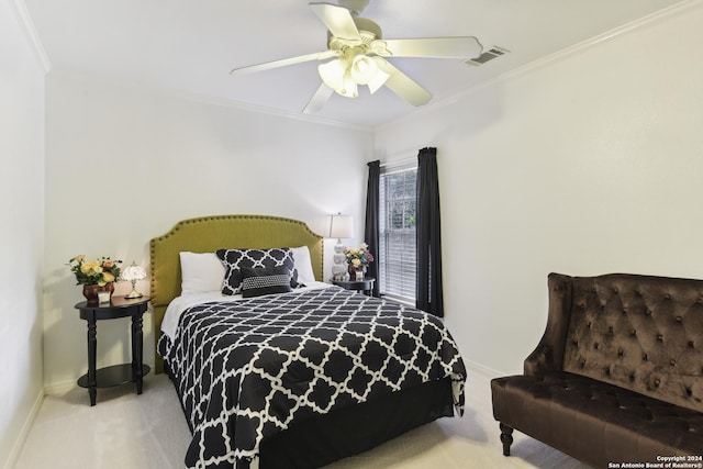 bedroom featuring ceiling fan, carpet floors, visible vents, and crown molding