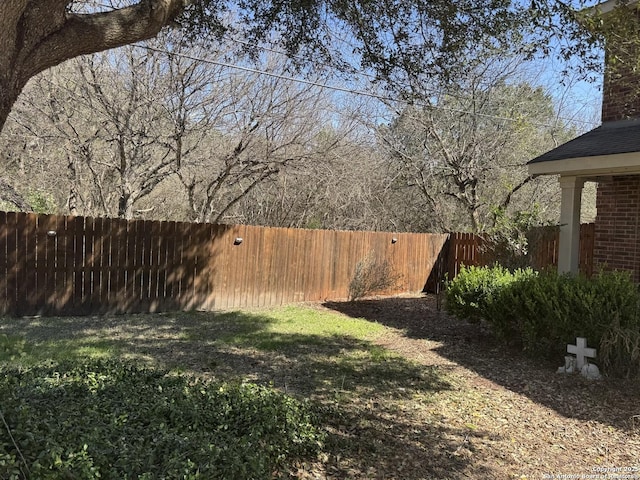 view of yard with a fenced backyard