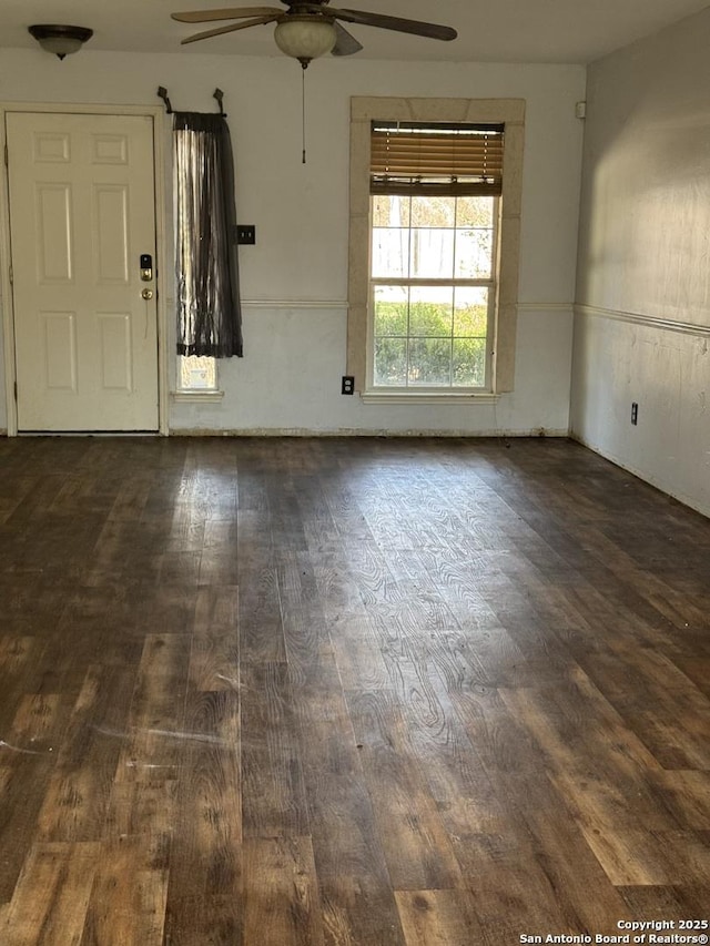 interior space featuring a ceiling fan and wood finished floors