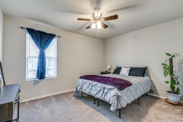 bedroom featuring carpet, baseboards, and ceiling fan