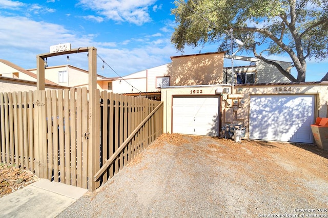 exterior space with driveway and fence