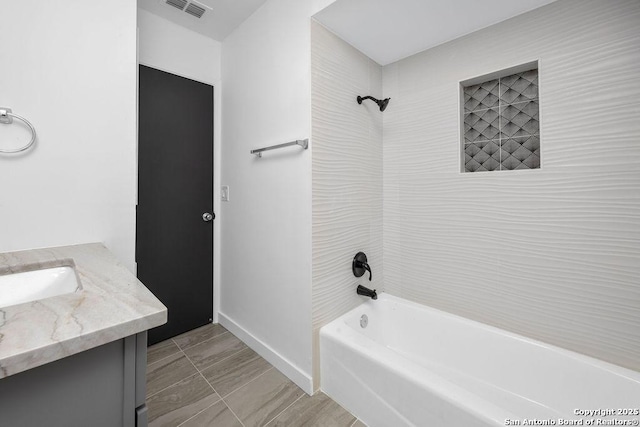 full bath with bathtub / shower combination, visible vents, vanity, and baseboards