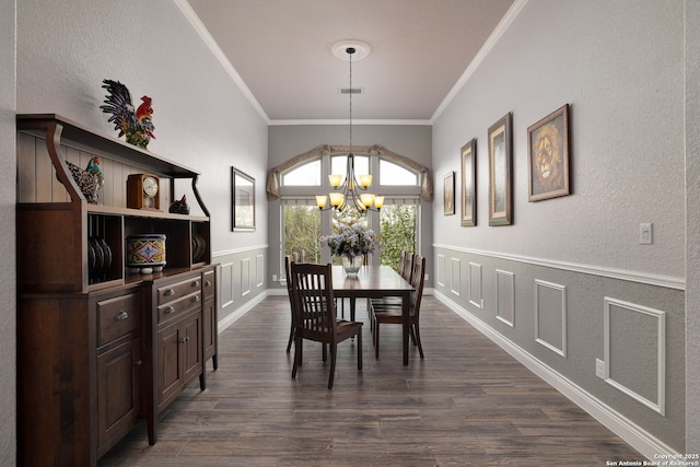 dining space with visible vents, dark wood-style floors, ornamental molding, a chandelier, and a decorative wall