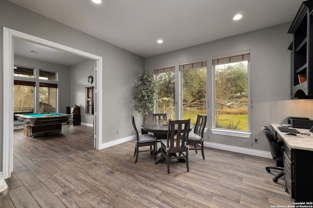 dining space with recessed lighting, baseboards, and wood finished floors