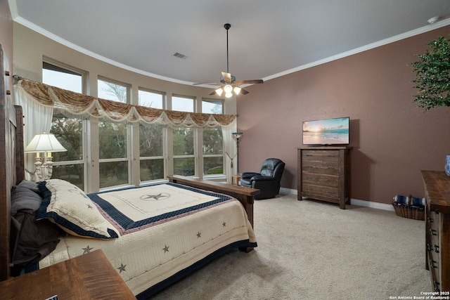 carpeted bedroom featuring ornamental molding, a ceiling fan, visible vents, and baseboards