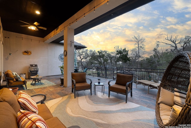 view of patio with ceiling fan, an outdoor hangout area, and area for grilling