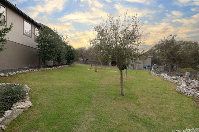 yard at dusk with fence