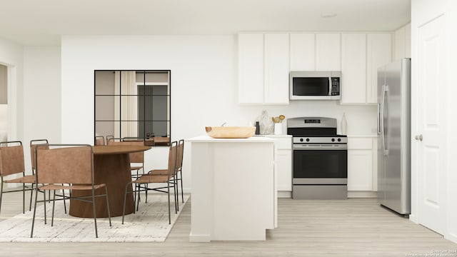 kitchen with white cabinetry, appliances with stainless steel finishes, light wood-style flooring, and light countertops