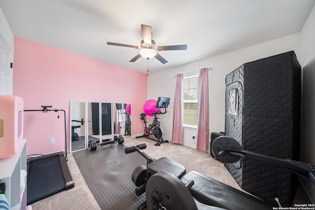 workout area with baseboards and a ceiling fan