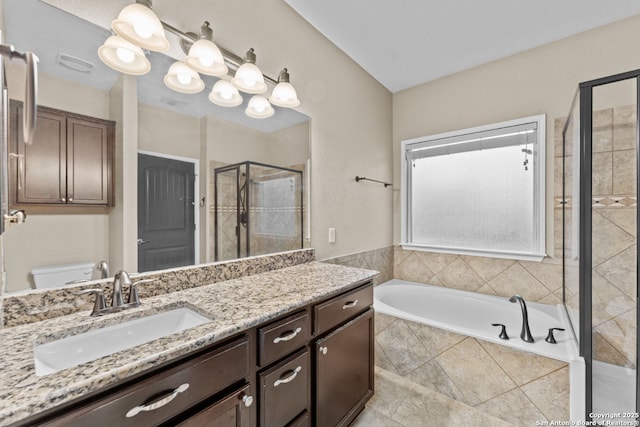 full bathroom with visible vents, toilet, a garden tub, vanity, and a shower stall