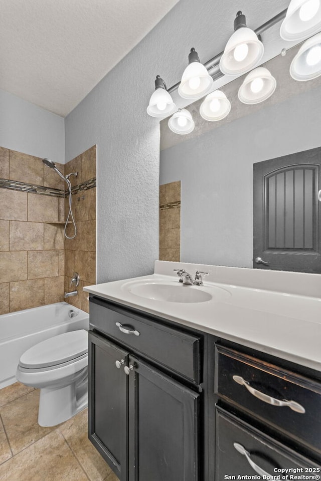 full bath with a textured ceiling, a textured wall, toilet, vanity, and washtub / shower combination