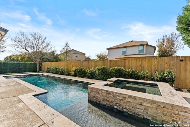 view of pool featuring a fenced in pool, a fenced backyard, a patio, and an in ground hot tub