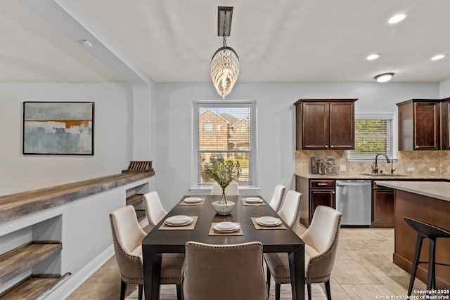 dining room with recessed lighting and light tile patterned flooring