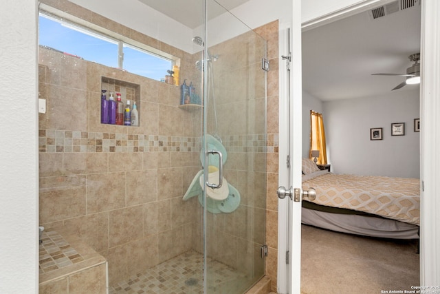 ensuite bathroom with a stall shower, ensuite bath, visible vents, and a ceiling fan