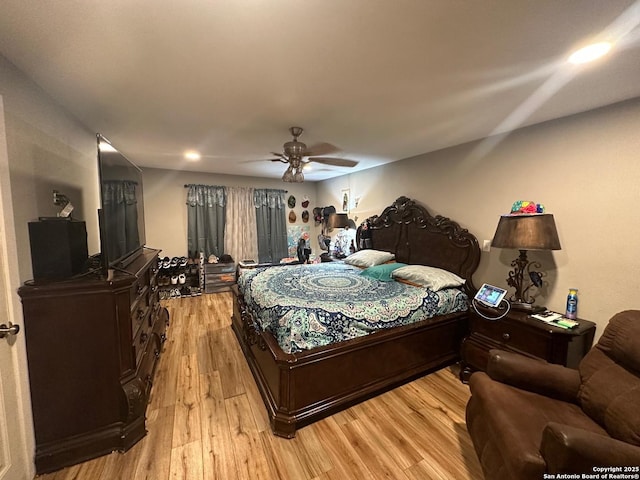 bedroom with light wood finished floors and ceiling fan