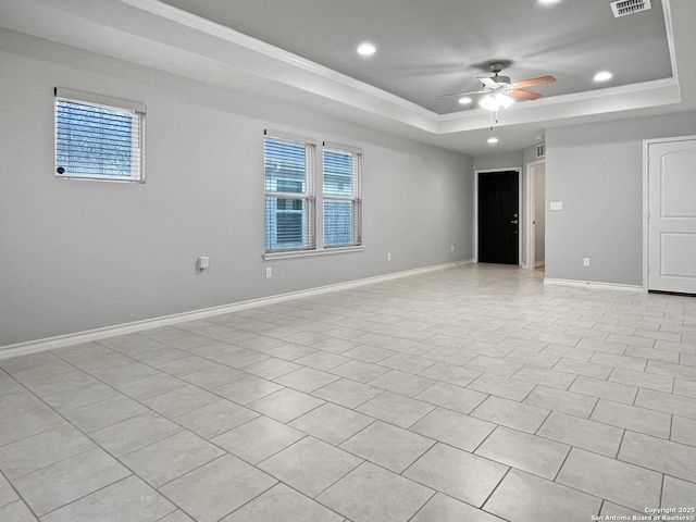 unfurnished room featuring ceiling fan, recessed lighting, visible vents, baseboards, and a raised ceiling