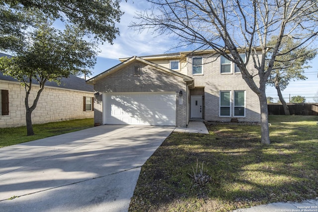 traditional home with a garage, concrete driveway, brick siding, and a front lawn