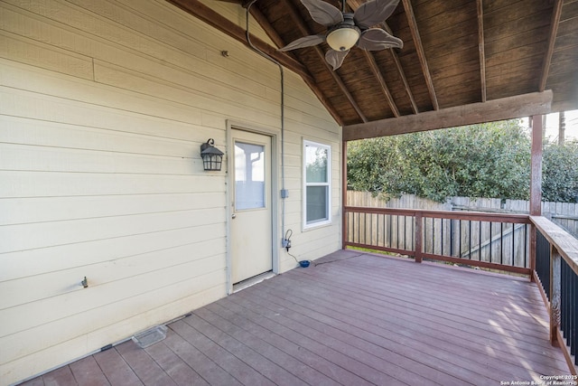 wooden terrace featuring ceiling fan and fence