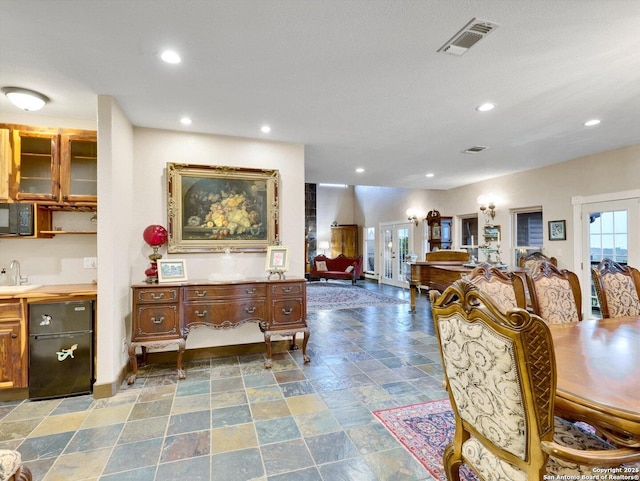 dining area with baseboards, visible vents, stone finish floor, french doors, and recessed lighting