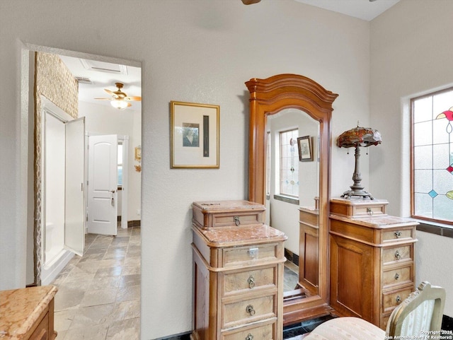 hall with a wealth of natural light and attic access