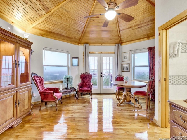 living area with wooden ceiling, vaulted ceiling, light wood finished floors, and french doors