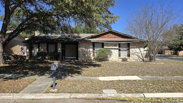 view of front of property featuring stone siding