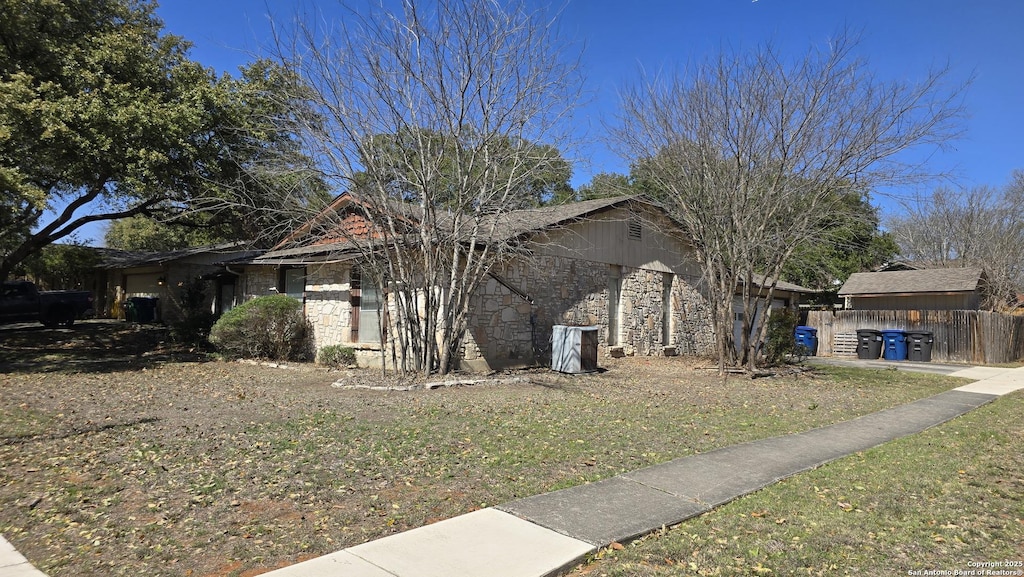 view of home's exterior with stone siding