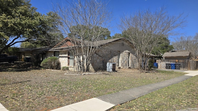 view of home's exterior with stone siding