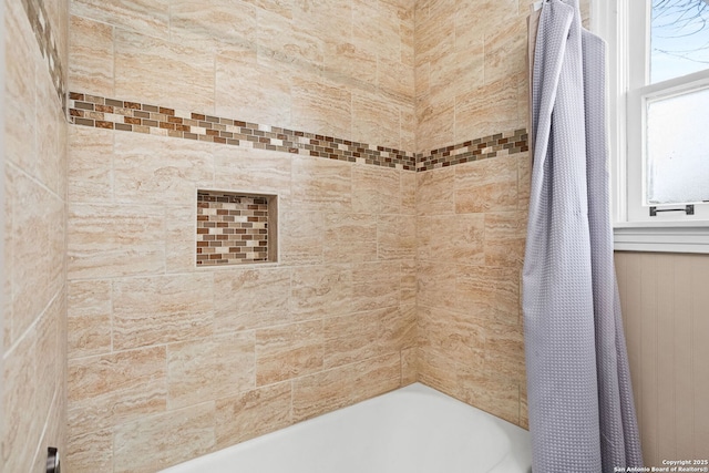 bathroom with shower / tub combo with curtain