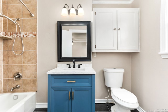 bathroom featuring vanity, shower / tub combination, toilet, and baseboards