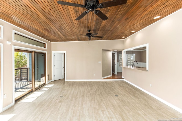 spare room with baseboards, wood ceiling, wood finished floors, a sink, and recessed lighting