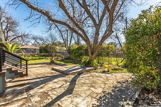 view of patio featuring fence