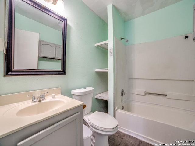 full bathroom with tub / shower combination, vanity, and toilet