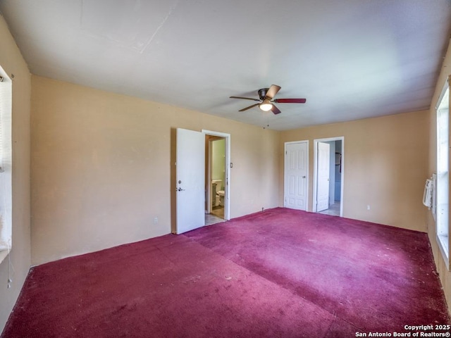 unfurnished room with carpet and ceiling fan