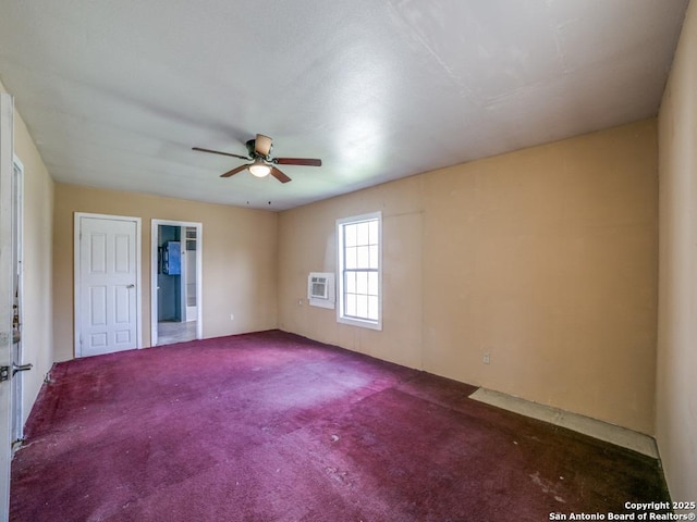 unfurnished room with carpet flooring, ceiling fan, and a wall unit AC