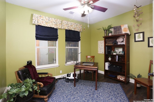 office with a ceiling fan, baseboards, visible vents, and wood finished floors